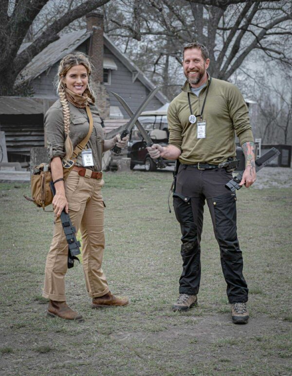 Melissa Backwoods showcasing the Gallantry survival knife alongside Jason Marsteiner during a field training session.