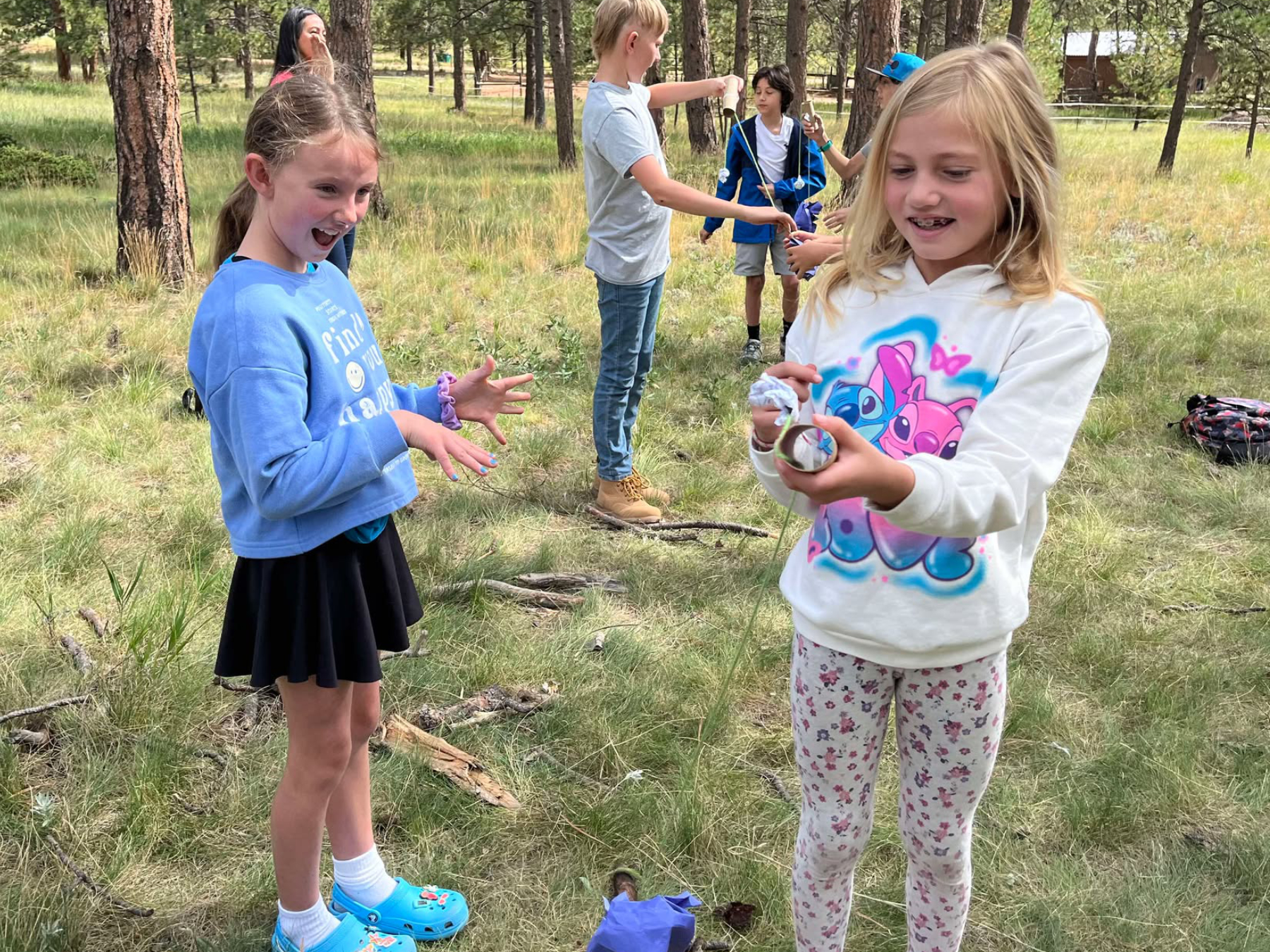 TSU Kids & Family Outdoor Survival Program Kids smiling and learning outdoor skills during a TSU family survival class