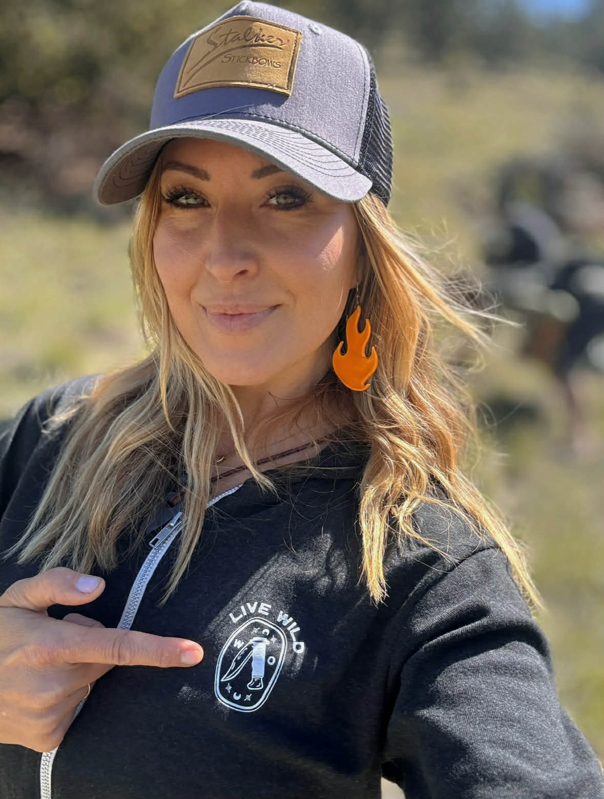 Outdoor instructor wearing Wildkind apparel during a women-only holistic survival training weekend in the Colorado mountains.