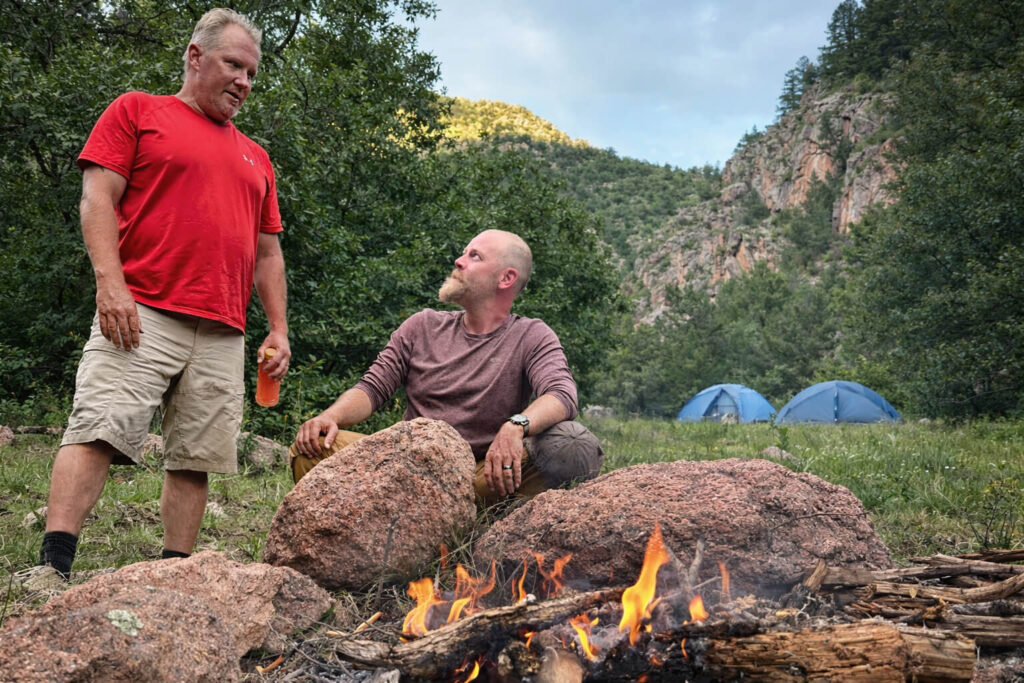 Relaxed campfire in calm conditions with experienced outdoor enthusiasts in a forgiving environment