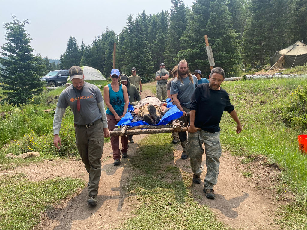 wilderness first aid patient evacuation litter carry backcountry training scenario